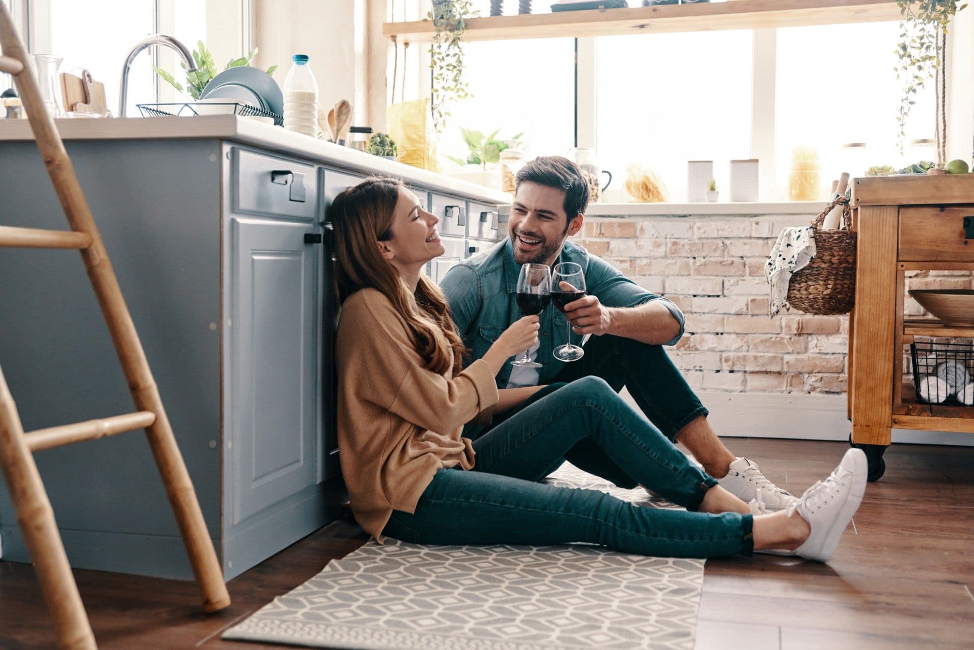 Couple laughing on floor