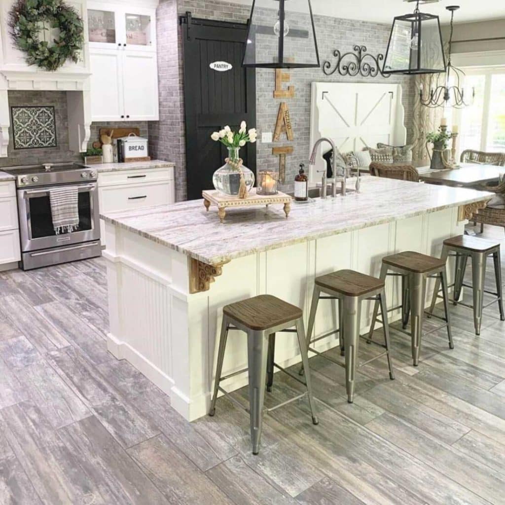 rustic looking kitchen with a white and brown color scheme and black accents