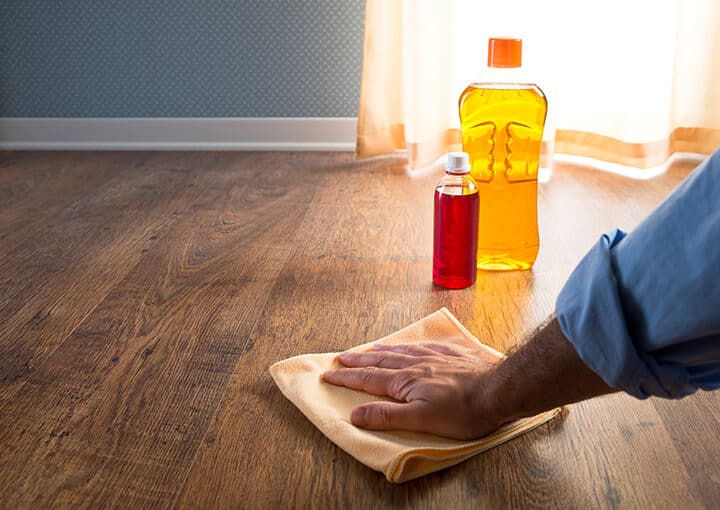 Male,Hand,Applying,Wood,Care,Products,On,Hardwood,Floor,Surface